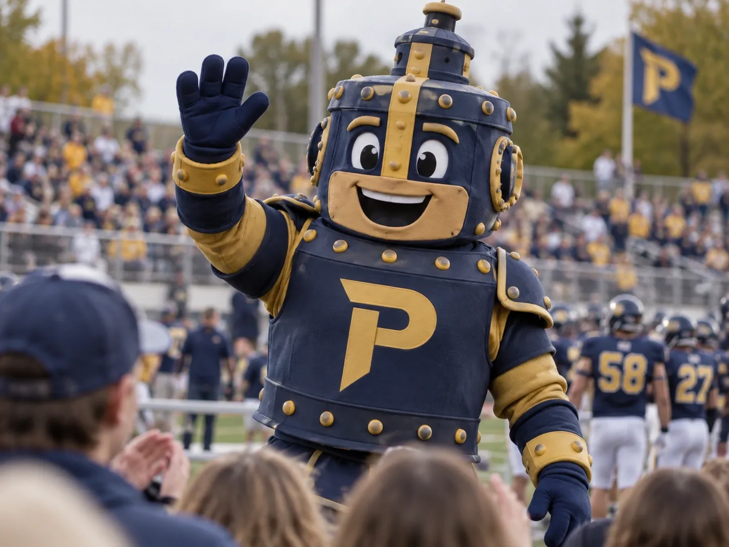 The Ironclad mascot waving to the crowd at a home game.