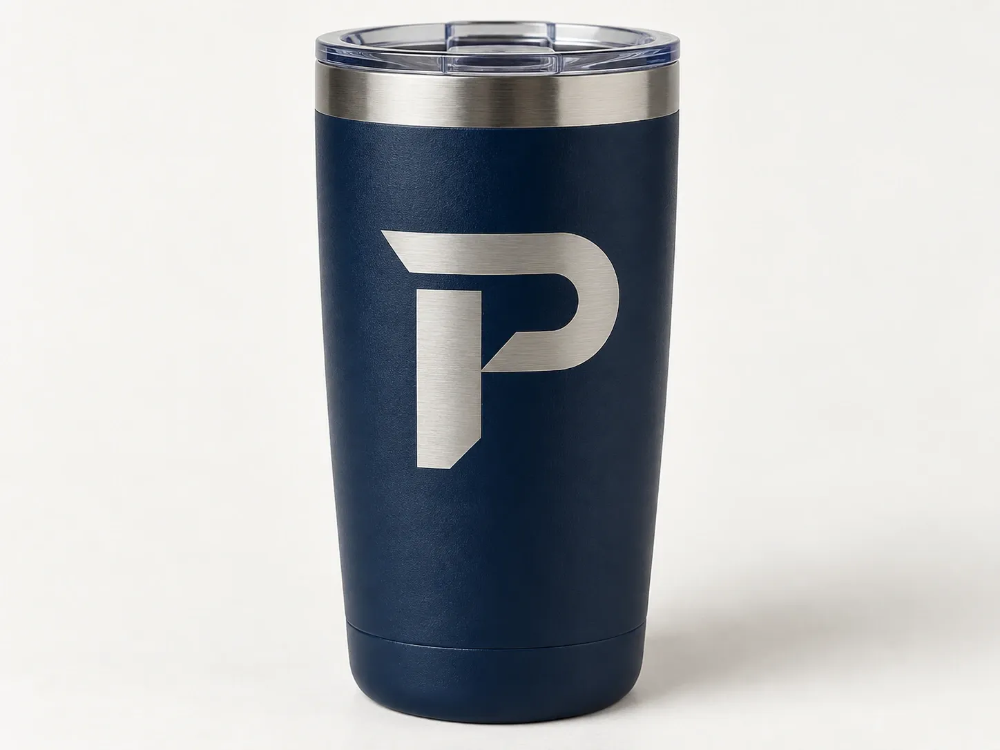 A navy steel tumbler with a laser-etched P monogram.