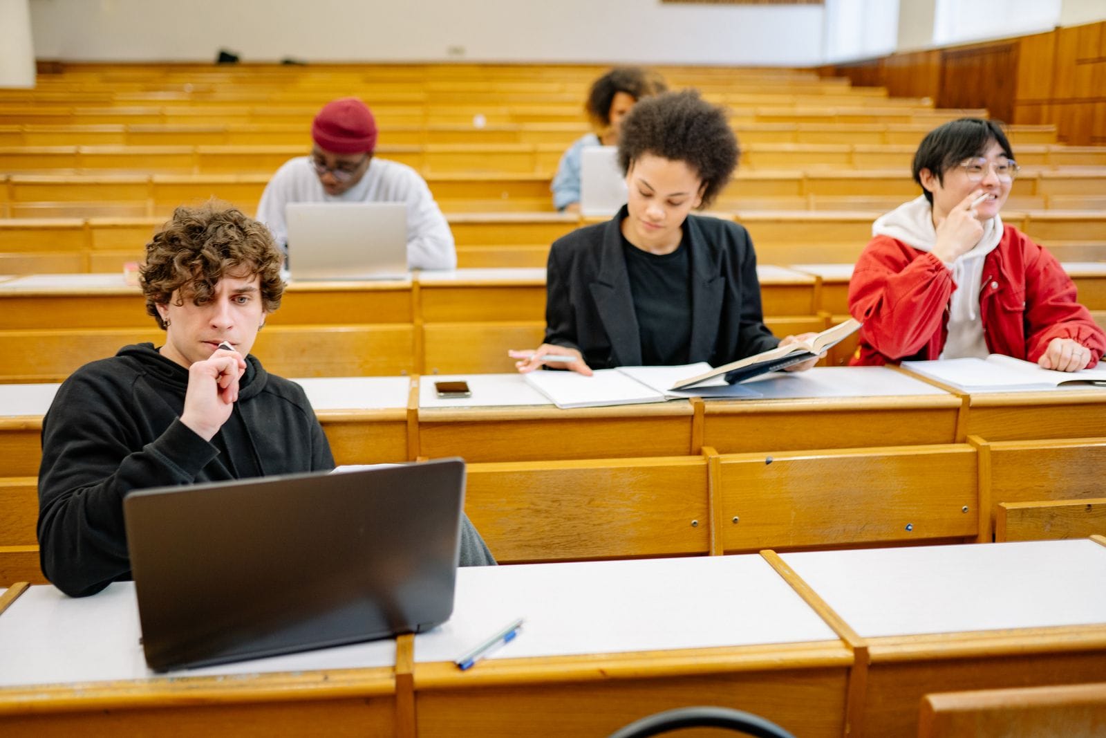 business administration program — Students collaborating in a college classroom.