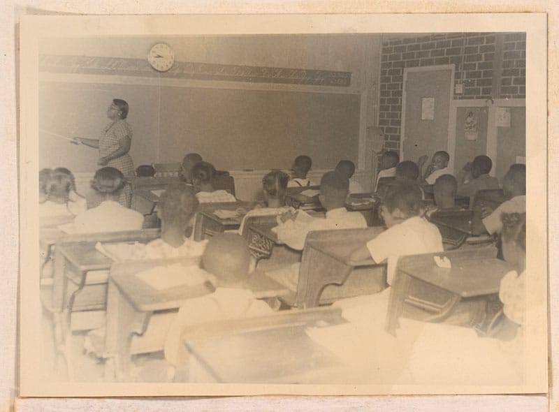 A historic photo of a classroom on campus.