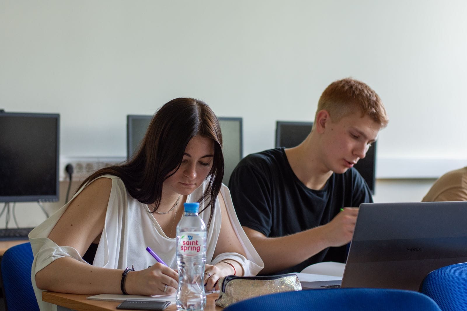 cybersecurity program — Students collaborating in a computer lab.