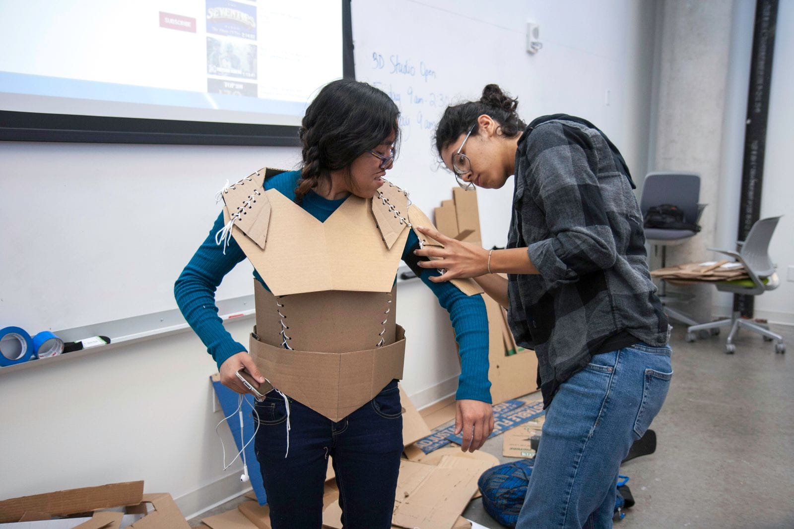 graphic design program — Design students working together in a studio.