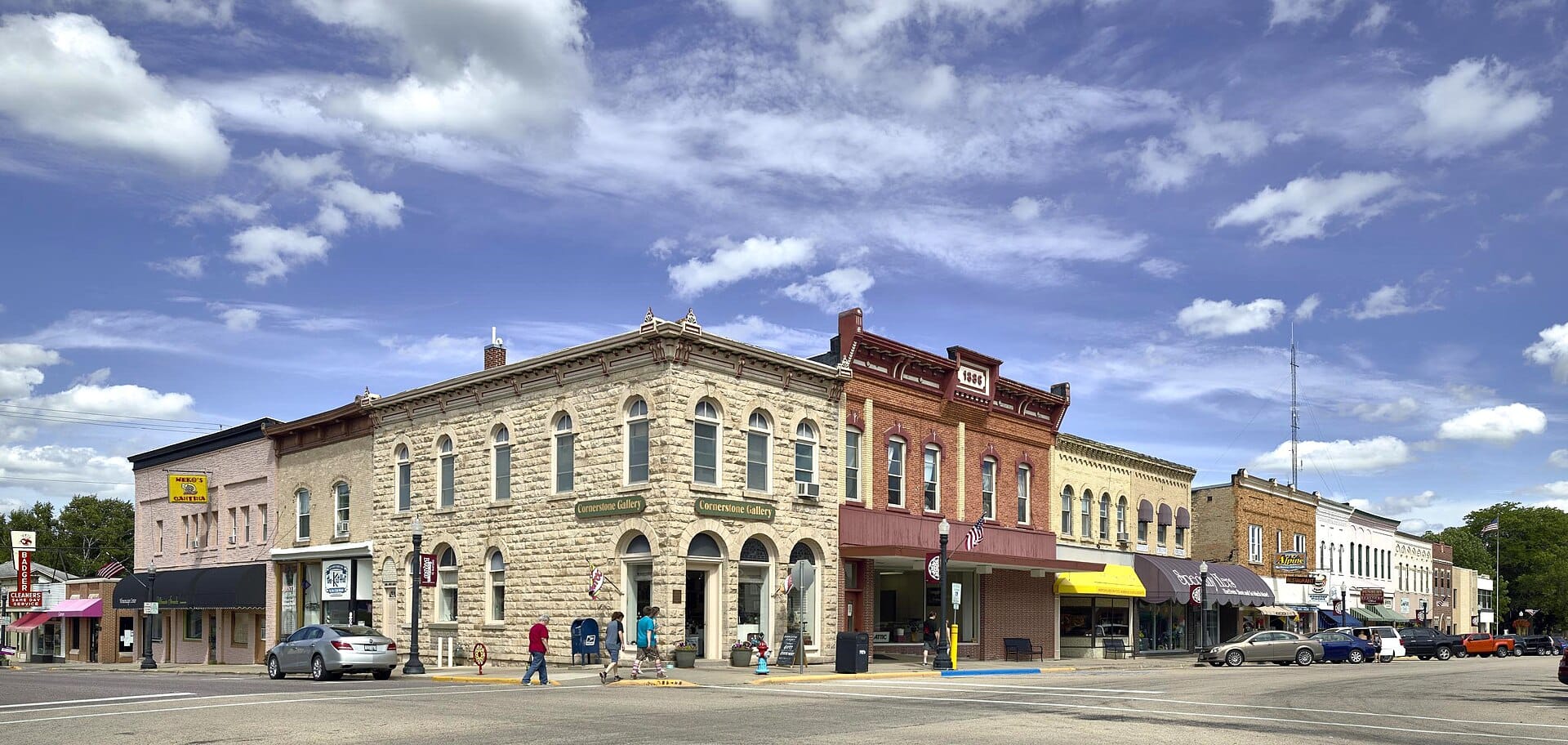 A small downtown street lined with storefronts.